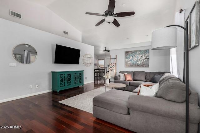 living room featuring visible vents, a ceiling fan, wood finished floors, and vaulted ceiling
