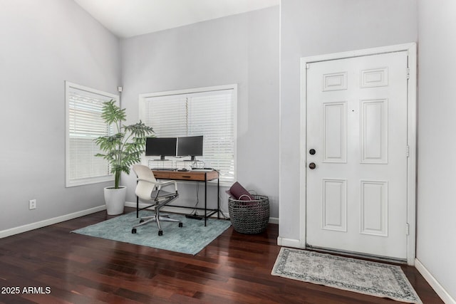 office space featuring baseboards and wood finished floors