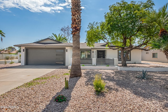 ranch-style house featuring a garage