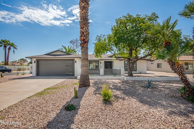 ranch-style home with a garage