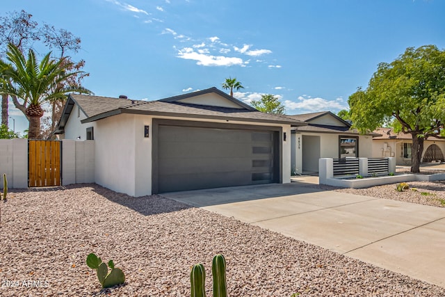 ranch-style house featuring a garage