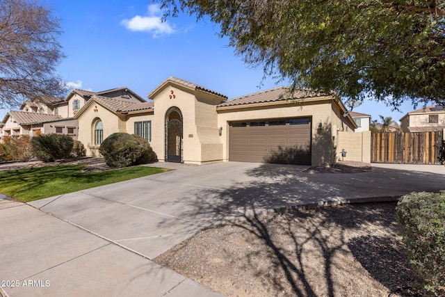 mediterranean / spanish home featuring a garage