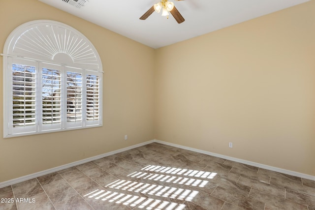 spare room with ceiling fan