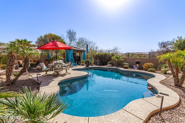 view of swimming pool featuring a patio area, a fenced backyard, and a fenced in pool