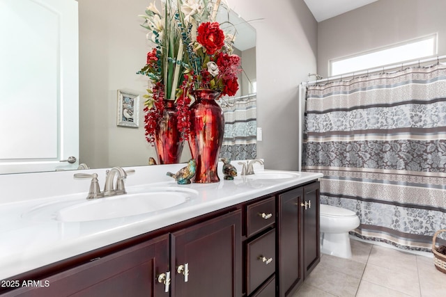 full bathroom featuring tile patterned flooring, a sink, toilet, and double vanity