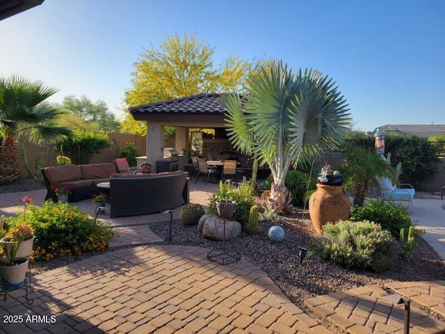 view of patio / terrace featuring outdoor lounge area and fence