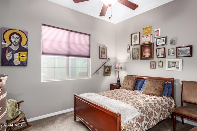 carpeted bedroom with a ceiling fan and baseboards