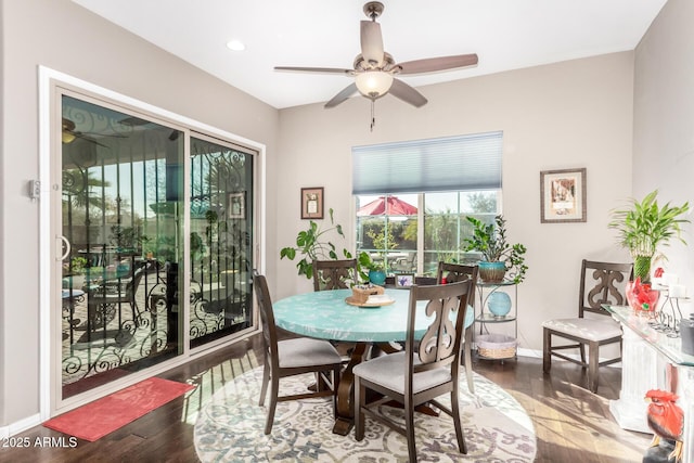 dining room featuring a ceiling fan, baseboards, wood finished floors, and recessed lighting