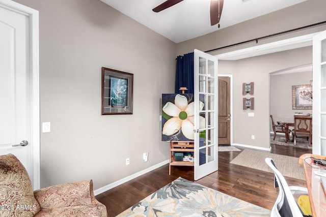 home office featuring ceiling fan, baseboards, wood finished floors, and french doors