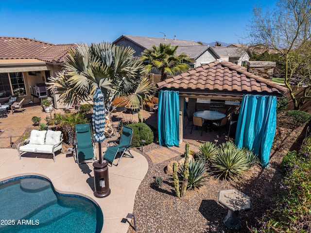 outdoor pool featuring a gazebo and a patio