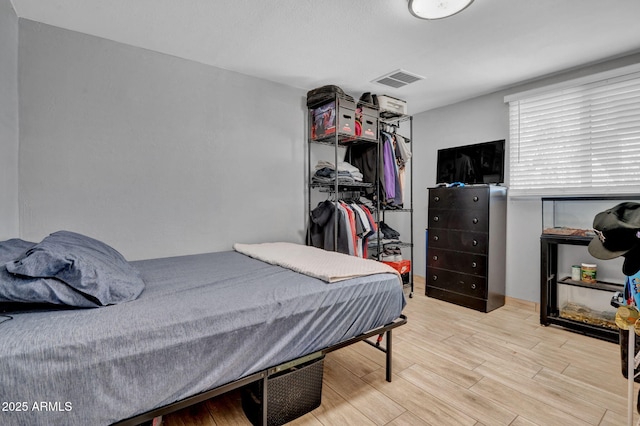 1815 E Illini St, Phoenix, AZ 85040 - bedroom featuring a closet, visible vents, and wood finished floors