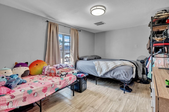 1815 E Illini St, Phoenix, AZ 85040 - bedroom featuring visible vents and wood finished floors