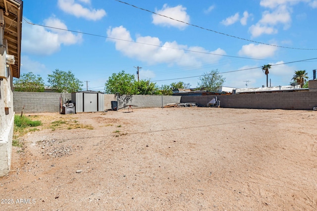 1815 E Illini St, Phoenix, AZ 85040 - view of yard featuring a storage unit, an outbuilding, and a fenced backyard