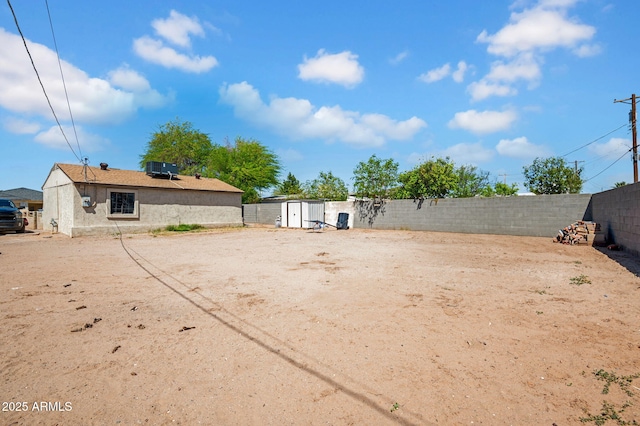 1815 E Illini St, Phoenix, AZ 85040 - view of yard with a storage shed, a fenced backyard, and an outdoor structure