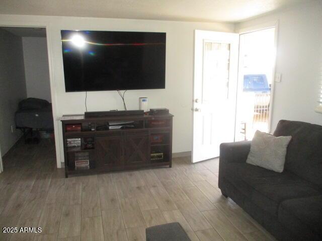 1815 E Illini St, Phoenix, AZ 85040 - living area featuring light wood-style floors