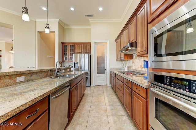 20609 N Canyon Whisper Dr, Surprise, AZ 85387 - kitchen with visible vents, light stone countertops, a sink, backsplash, and stainless steel appliances