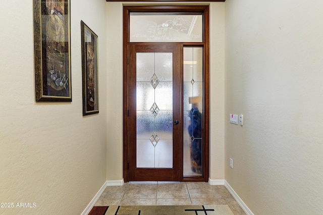 20609 N Canyon Whisper Dr, Surprise, AZ 85387 - foyer with baseboards, a textured wall, and light tile patterned floors