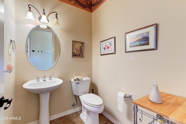 20609 N Canyon Whisper Dr, Surprise, AZ 85387 - bathroom with tile patterned floors, baseboards, and toilet