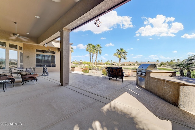 20609 N Canyon Whisper Dr, Surprise, AZ 85387 - view of patio / terrace with an outdoor kitchen, a ceiling fan, and a grill