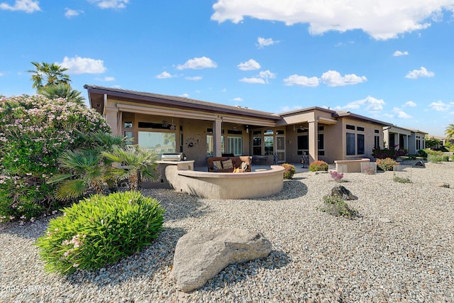 20609 N Canyon Whisper Dr, Surprise, AZ 85387 - back of property featuring a patio, a ceiling fan, and stucco siding