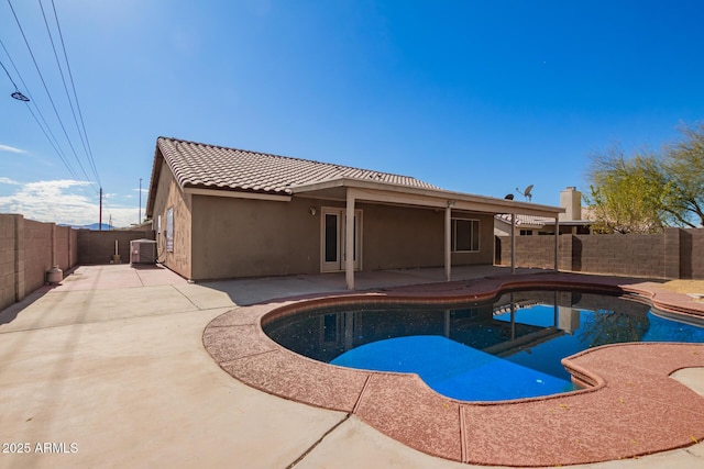 view of swimming pool featuring a patio and central AC