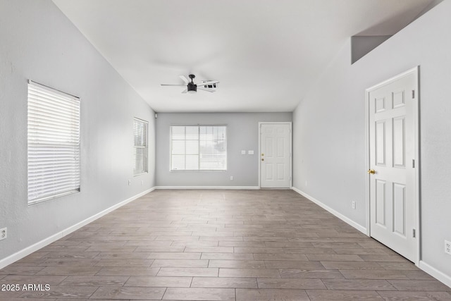 unfurnished room with ceiling fan and dark hardwood / wood-style flooring