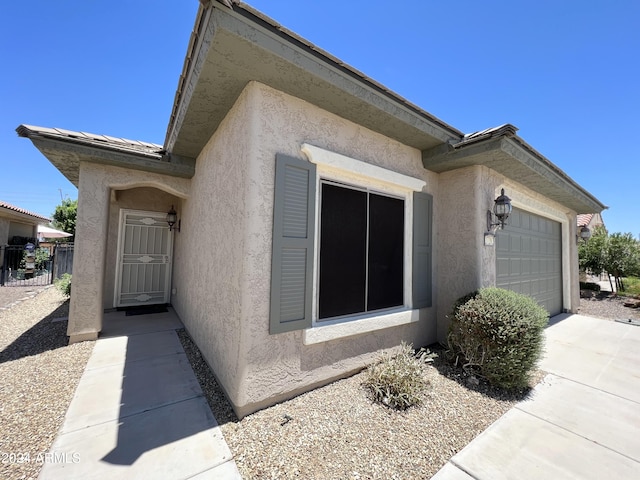 view of side of home featuring a garage