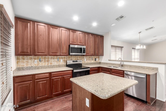 12838 W Desert Mirage Dr, Peoria, AZ 85383 - kitchen with a sink, appliances with stainless steel finishes, dark wood-type flooring, and visible vents