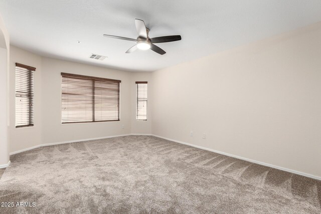 12838 W Desert Mirage Dr, Peoria, AZ 85383 - empty room with carpet flooring, ceiling fan, visible vents, and baseboards