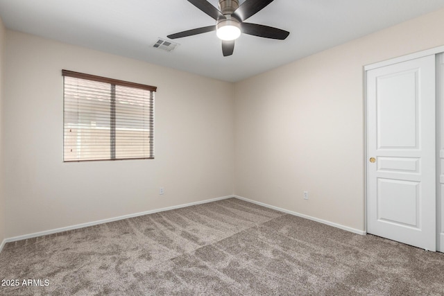 12838 W Desert Mirage Dr, Peoria, AZ 85383 - spare room featuring baseboards, ceiling fan, carpet, and visible vents