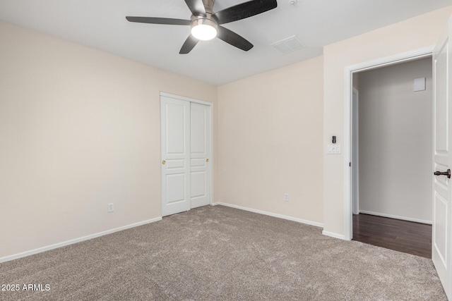 12838 W Desert Mirage Dr, Peoria, AZ 85383 - unfurnished bedroom featuring visible vents, carpet flooring, baseboards, and ceiling fan
