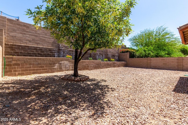 12838 W Desert Mirage Dr, Peoria, AZ 85383 - view of yard featuring a fenced backyard