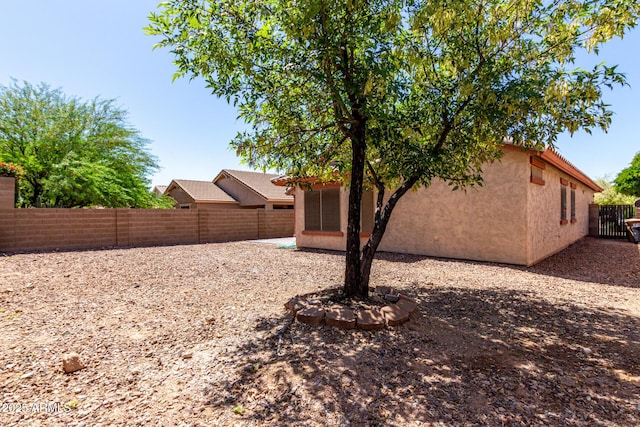 12838 W Desert Mirage Dr, Peoria, AZ 85383 - view of side of home featuring a fenced backyard and stucco siding
