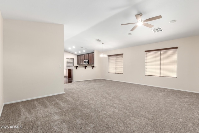 12838 W Desert Mirage Dr, Peoria, AZ 85383 - unfurnished living room with visible vents, lofted ceiling, baseboards, carpet, and ceiling fan with notable chandelier