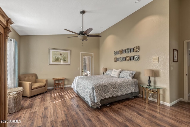 bedroom featuring ceiling fan, dark hardwood / wood-style flooring, and lofted ceiling