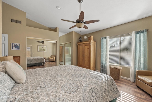 bedroom featuring ceiling fan, lofted ceiling, and hardwood / wood-style flooring