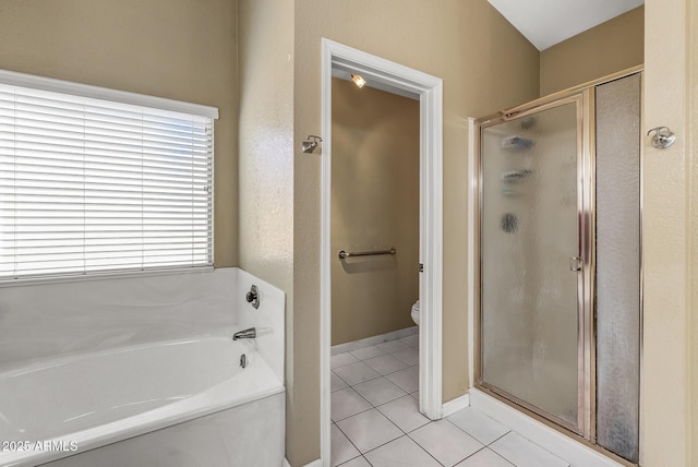 bathroom with toilet, separate shower and tub, and tile patterned flooring