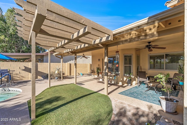 view of patio / terrace with ceiling fan and a pergola