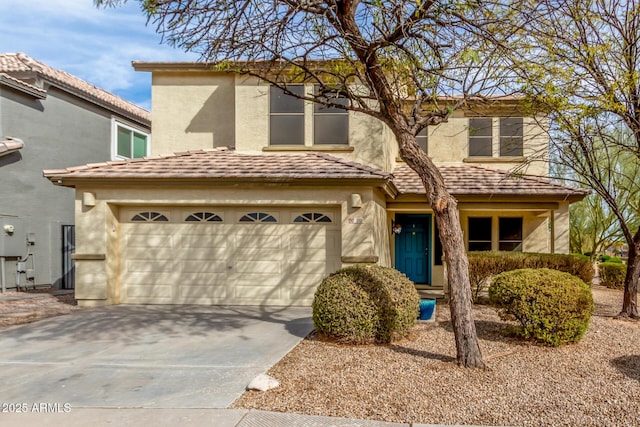 view of front facade featuring concrete driveway and stucco siding