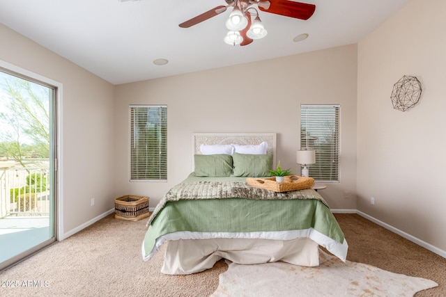 carpeted bedroom with baseboards, lofted ceiling, a ceiling fan, and access to outside