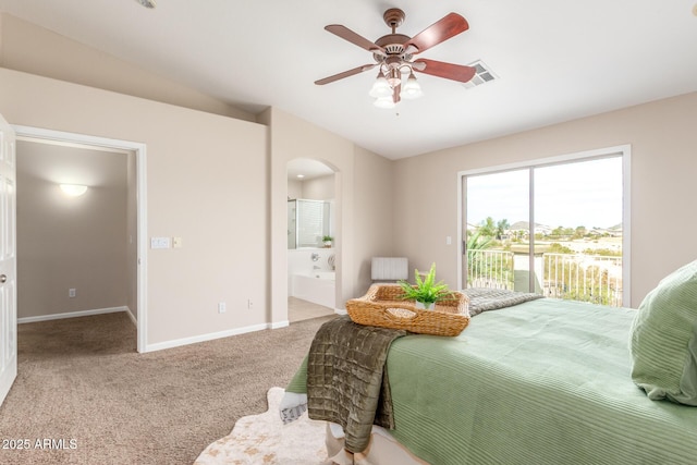 carpeted bedroom with access to exterior, visible vents, baseboards, vaulted ceiling, and arched walkways