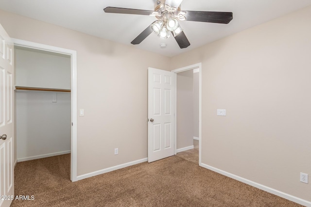 unfurnished bedroom with carpet, baseboards, and a closet