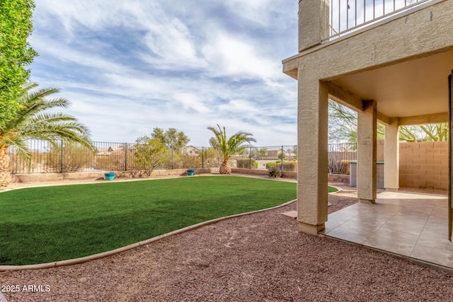 view of yard featuring a patio area and a fenced backyard