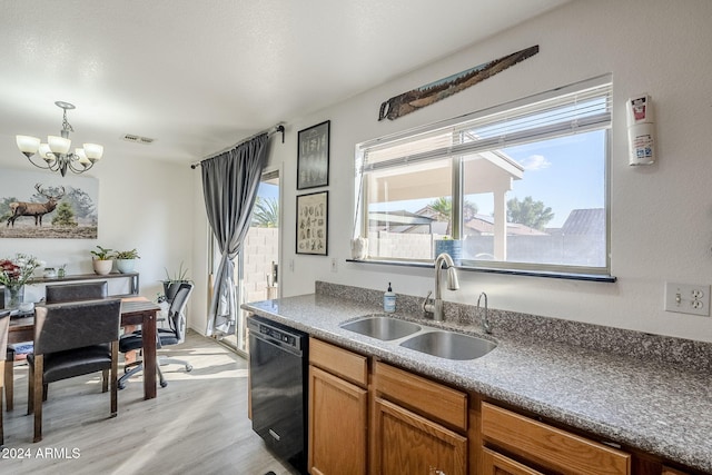 kitchen with black dishwasher, light hardwood / wood-style flooring, plenty of natural light, and sink