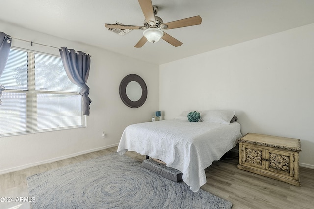 bedroom featuring ceiling fan and light hardwood / wood-style flooring