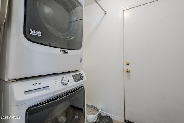 laundry area featuring stacked washer and clothes dryer