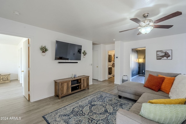 living room with ceiling fan and light wood-type flooring