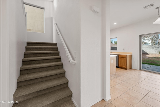 stairs featuring tile patterned floors