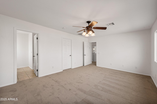 unfurnished bedroom with ceiling fan and light carpet