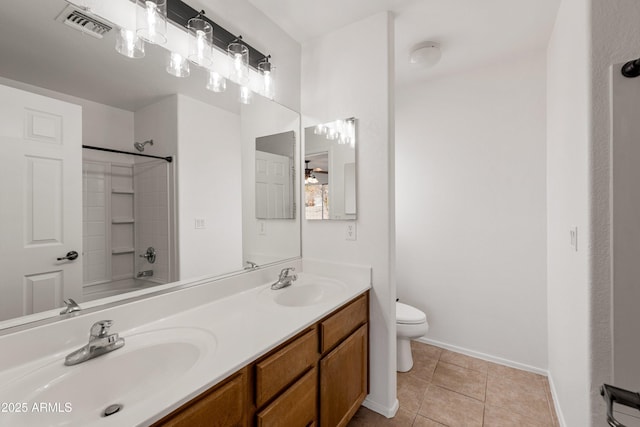 full bathroom with tile patterned floors, vanity, toilet, and shower / tub combination